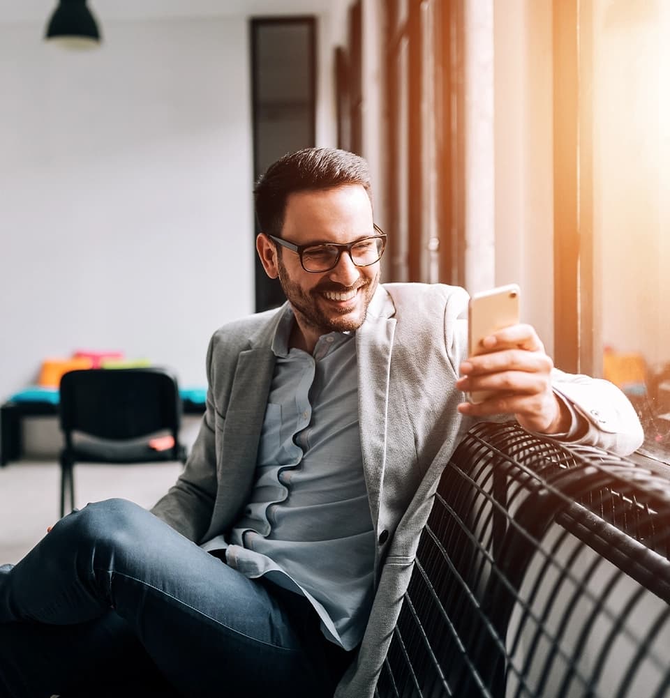 Clients and Reviews Banner on Man Smiling With Cell Phone